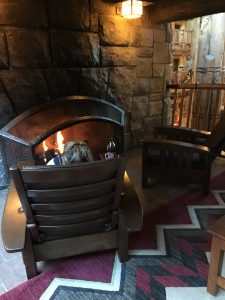 sitting in front of one of the fireplaces at the Wilderness Lodge