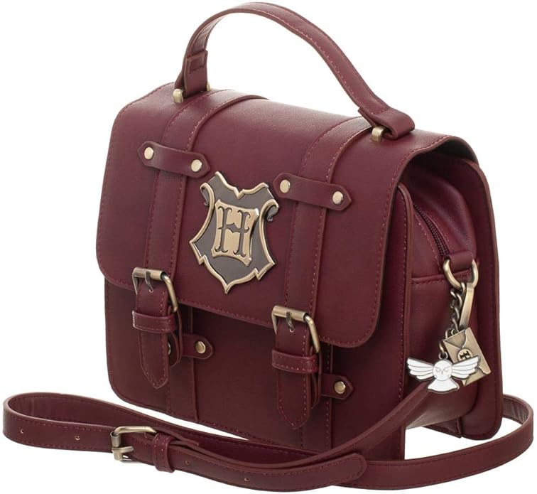 brown purse with hogwarts crest and charms